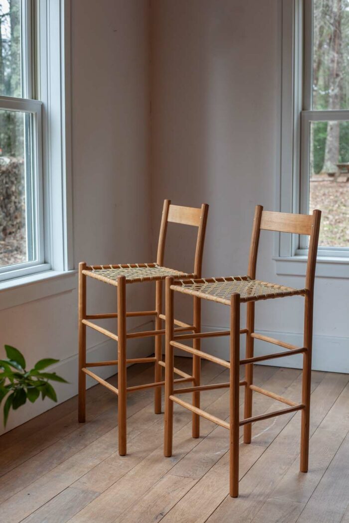 rawhide and wood chairs by Brian Persico