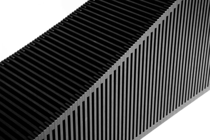 close up of black wood vertical panel sculpture with negative space in-between each panel, by Gunther Pfeffer