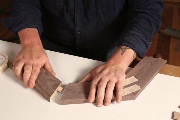 Mitered frame pieces being joined together with dominos