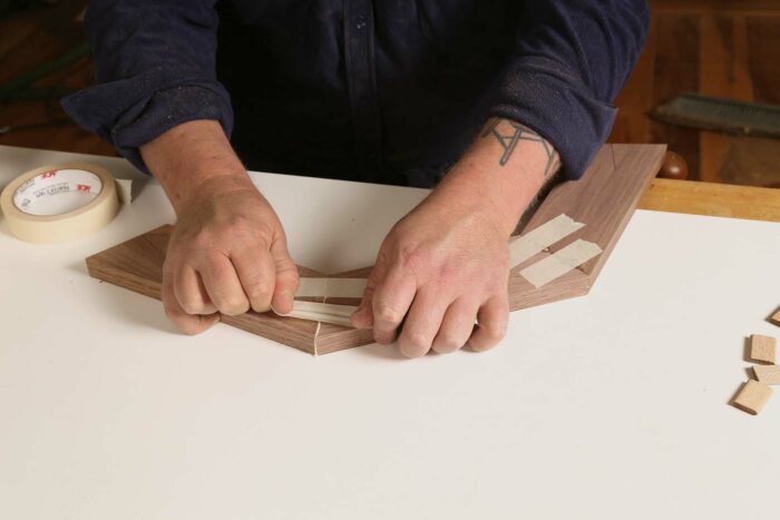 More pieces being glued together