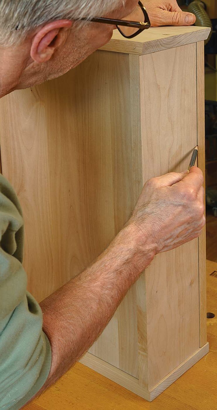 Trim the last door edge. Working from the back of the cabinet, with the door closed, use a sharp pencil to mark where to trim the latch side of the door. Then remove the door, trim that last edge, reinstall the door one last time, and admire a job well done.