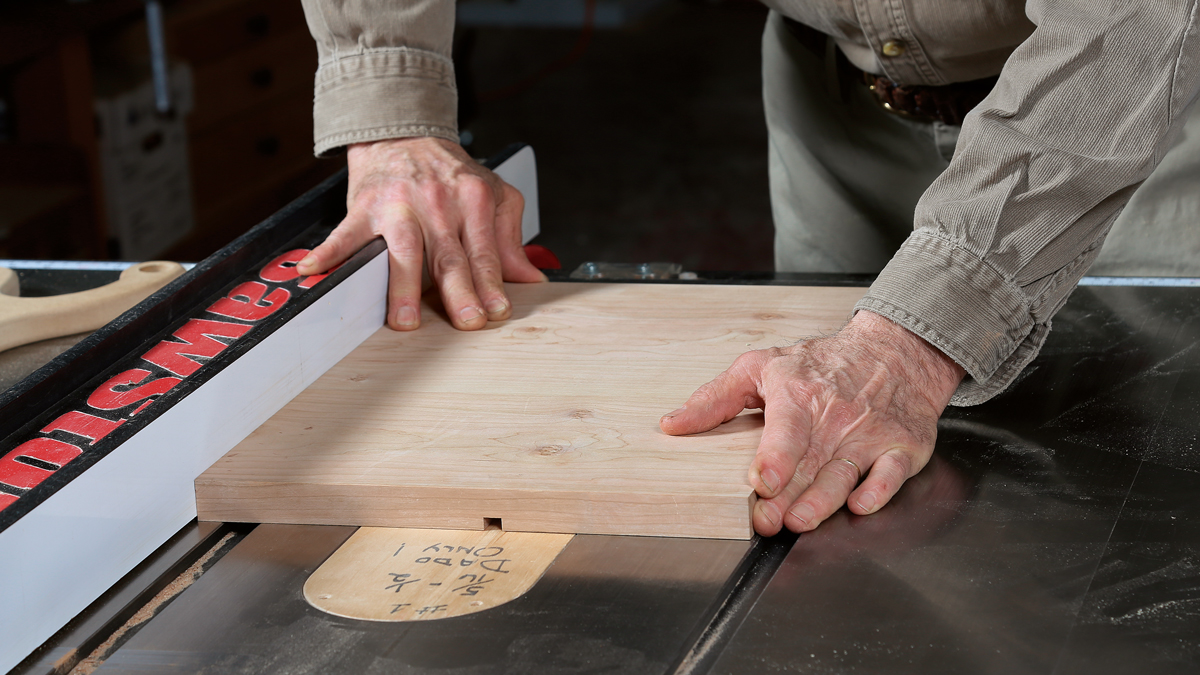 The dado size depends on which dovetail you pick. If you are making a stepped-dovetail divider and your dado stack’s outside blades leave deeper scoring marks, level the bottom of the case dadoes with a router plane. Otherwise, the show face of the joint will have triangular gaps at the shoulder.